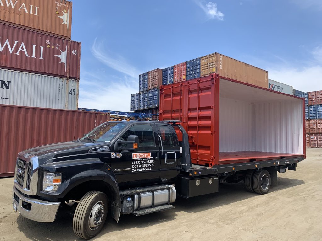 Open side container modification loaded on a UBOXIT truck